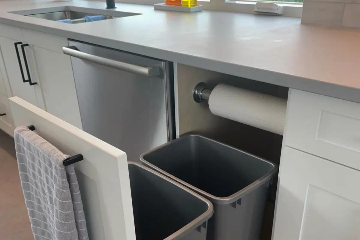 A custom cabinet for recycling bins using environmentally friendly lacquer.