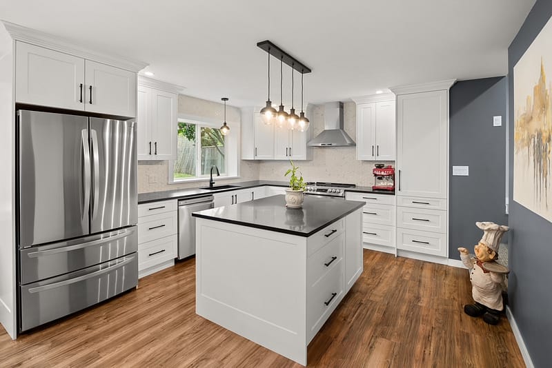 A completed kitchen with custom cabinets